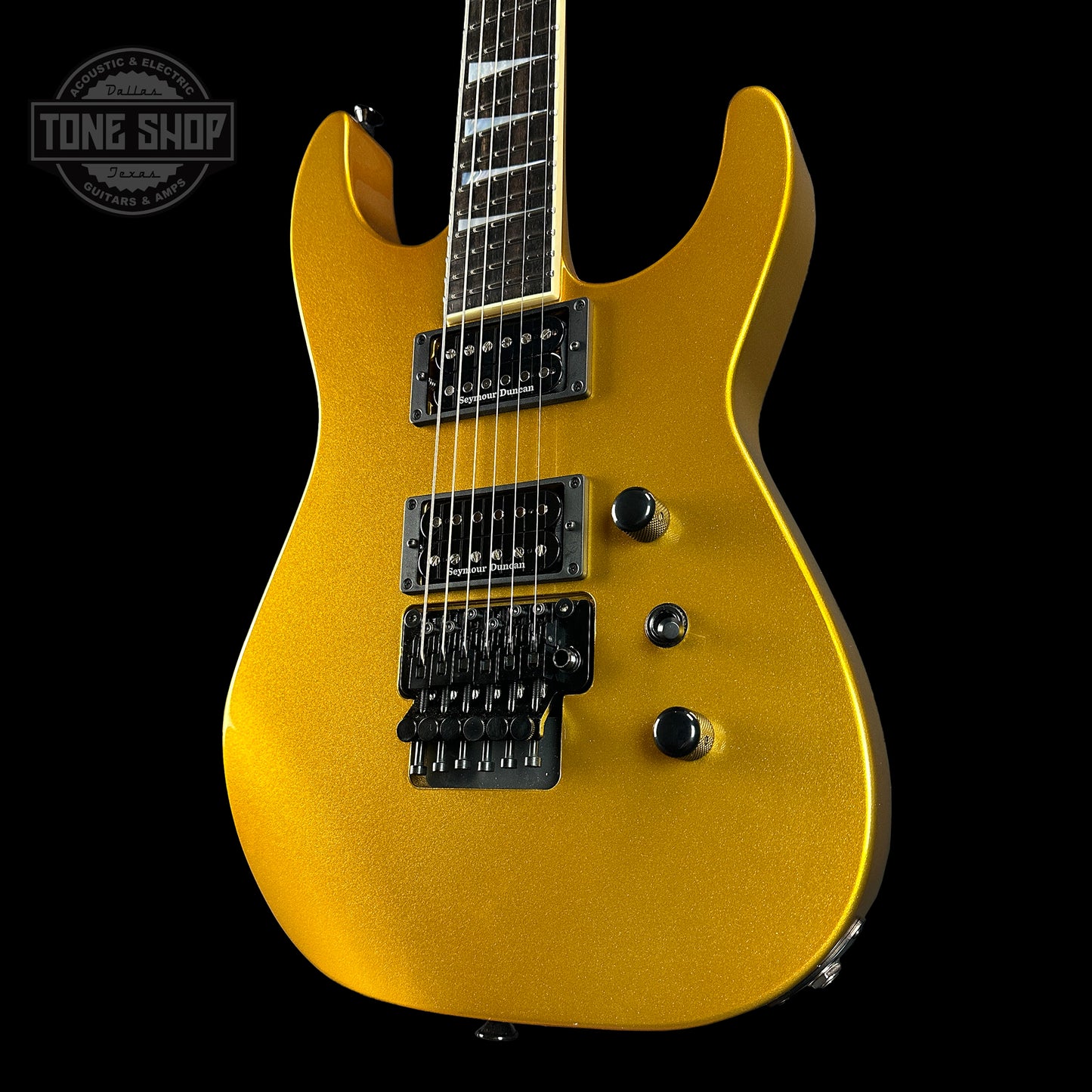 Front angle of Jackson Custom Shop SL2H Reverse Headstock Frost Gold.