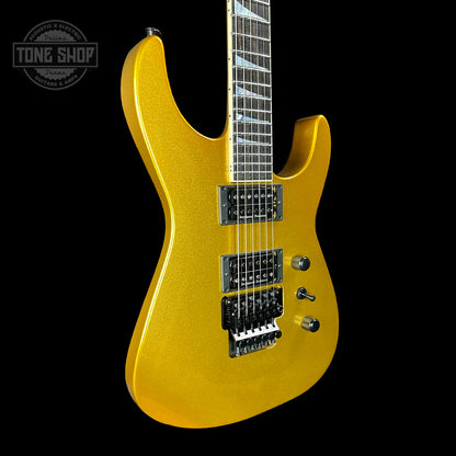 Front angle of Jackson Custom Shop SL2H Reverse Headstock Frost Gold.