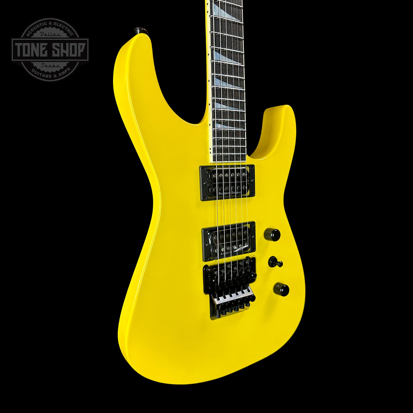 Front angle of Jackson Custom Shop SL2H Reverse Headstock Grafitti Yellow.