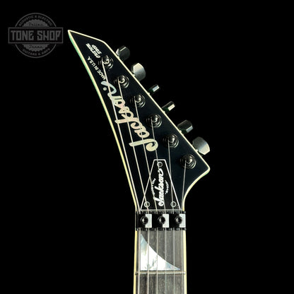 Front of headstock of Jackson Custom Shop SL1 Soloist RVRS FR Seafoam Sparkle.