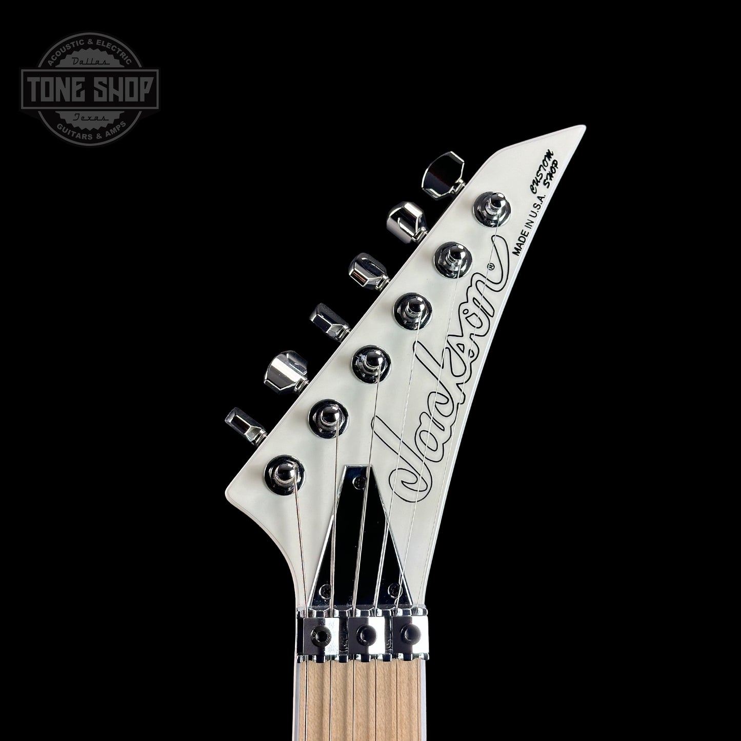 Front of headstock of Jackson Custom Shop Rhoads RR24 1H White Ghost Flame.