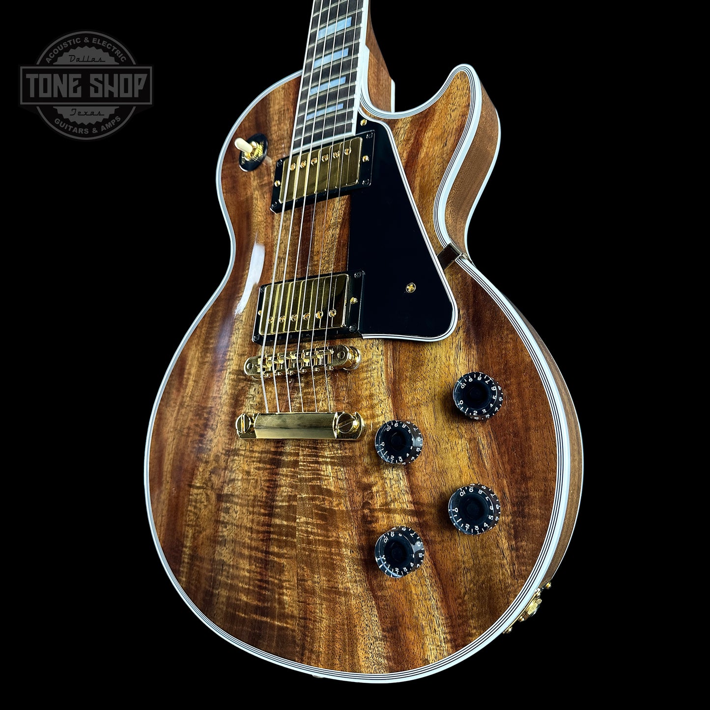 Front angle of Gibson Custom Shop Made 2 Measure Les Paul Custom Chambered Koa Gloss.