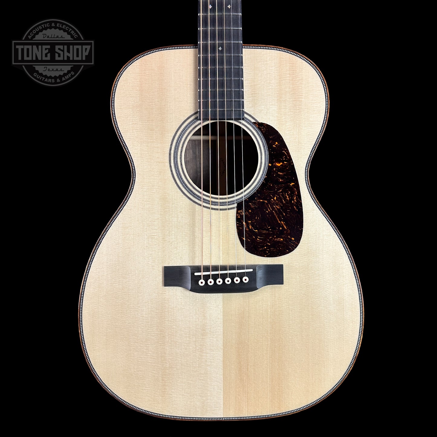 Front of Martin Custom Shop 28 Style 00-14F Italian Alpine Spruce/Exceptionally Figured Black Walnut.