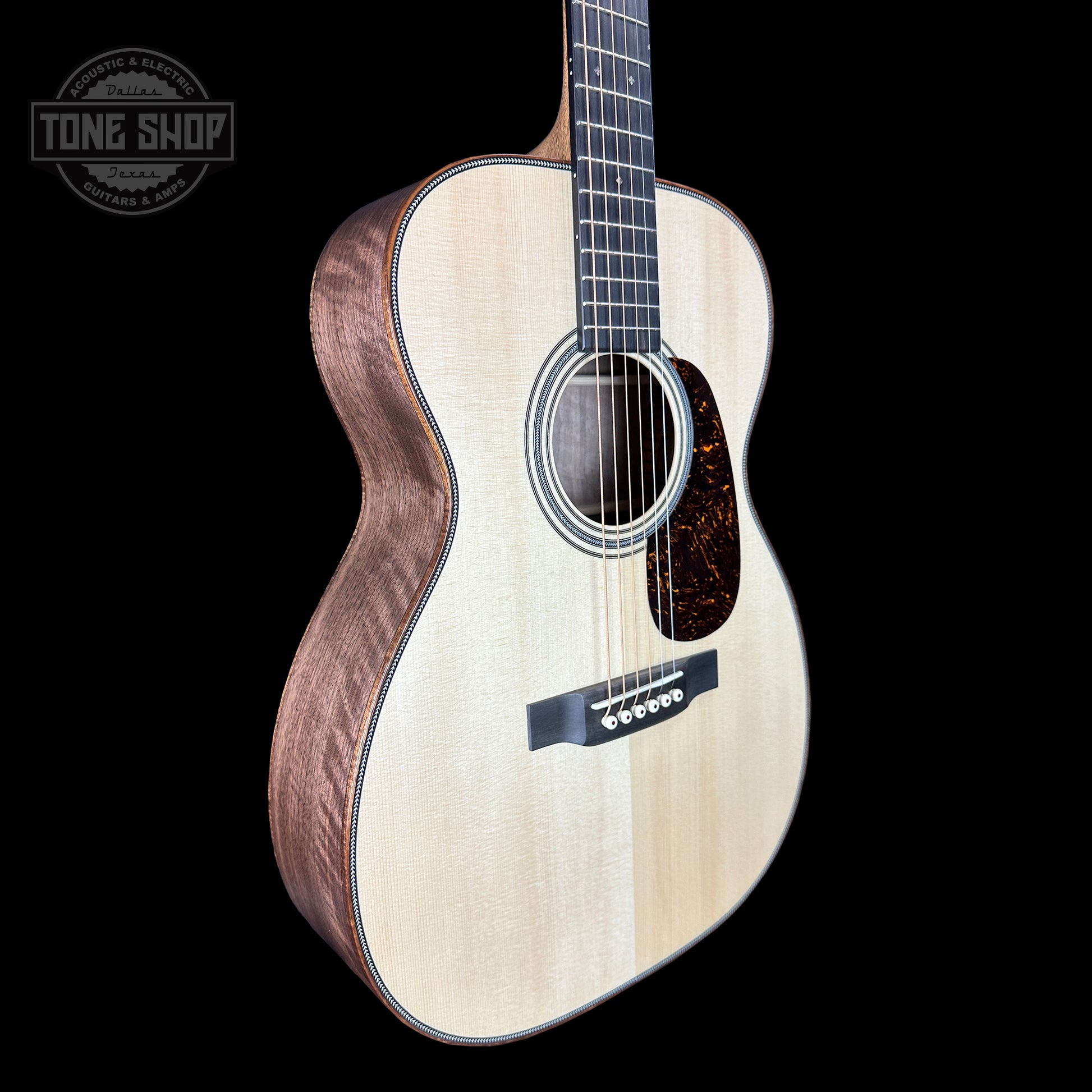 Front angle of Martin Custom Shop 28 Style 00-14F Italian Alpine Spruce/Exceptionally Figured Black Walnut.