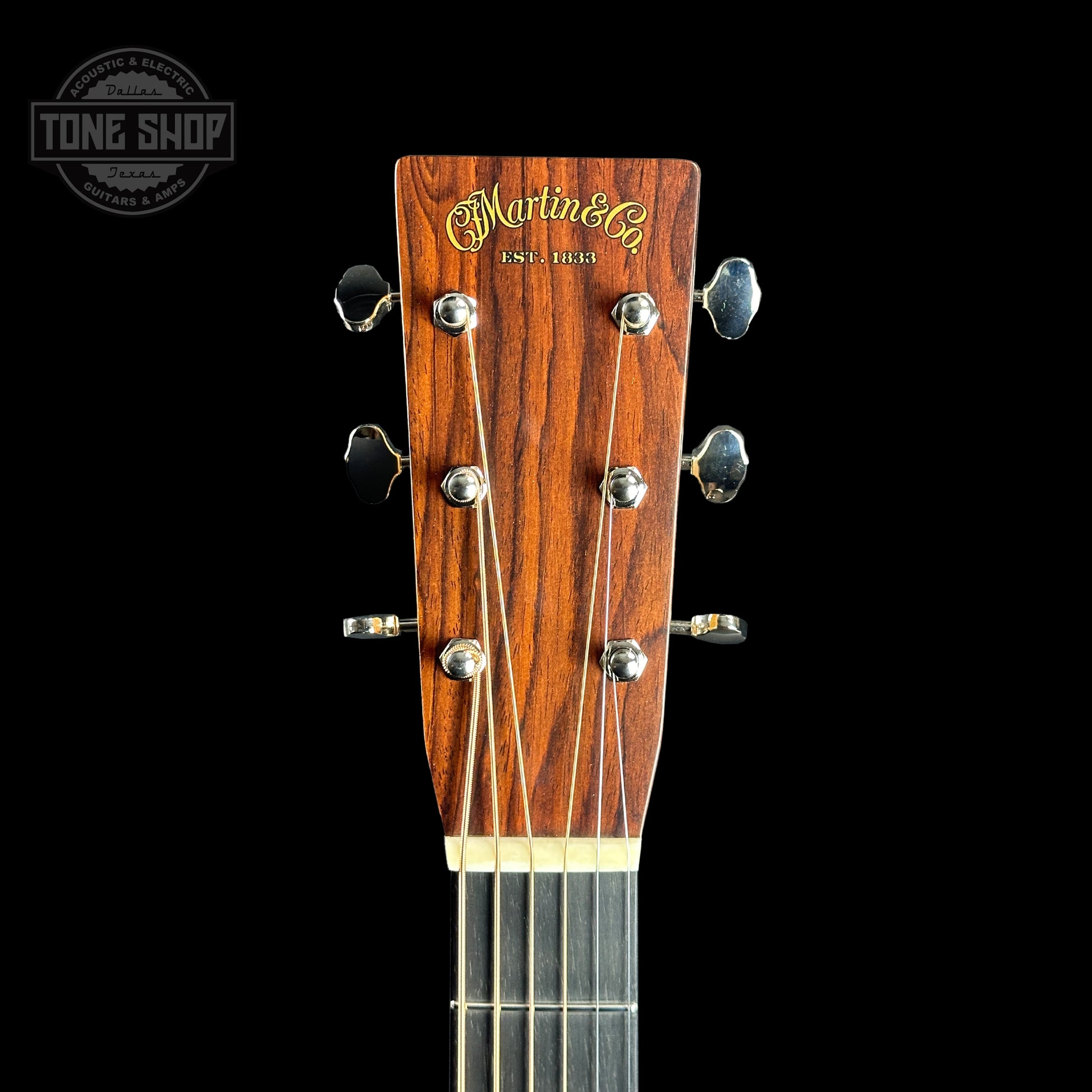 Front of headstock of Martin Custom Shop 28 Style Dread Adirondack/Cocobolo.