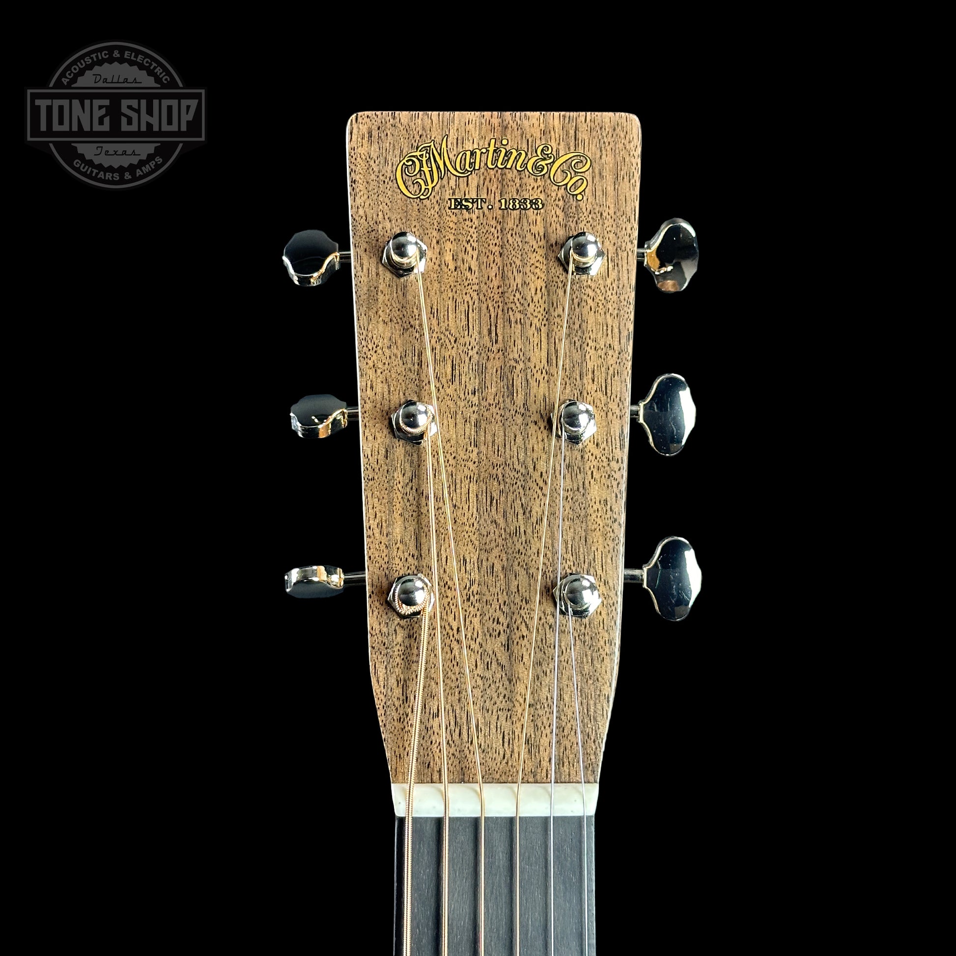 Front of headstock of Martin Custom Shop 28 Style 00-14F Italian Alpine Spruce/Exceptionally Figured Black Walnut.