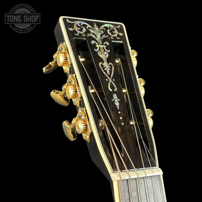 Front of headstock of Martin Custom Shop 00-42 Torch Motif Black Sitka/EIR.