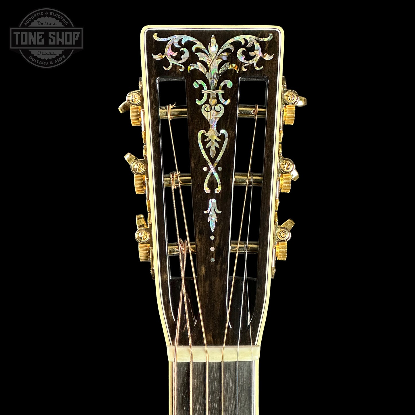 Front of headstock of Martin Custom Shop 00-42 Torch Motif Black Sitka/EIR.