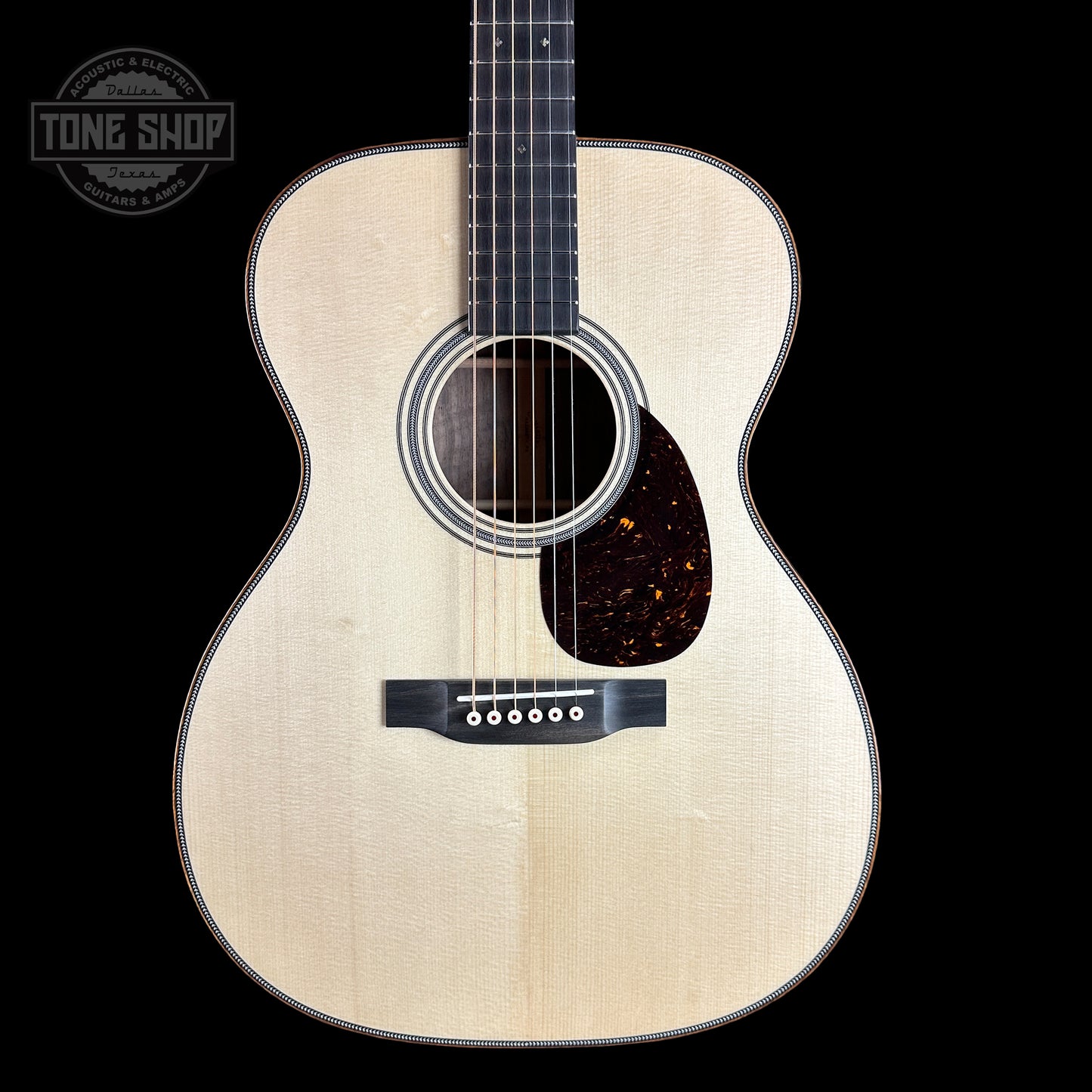 Front of Martin Custom Shop 28 Style OM Italian Alpine Spruce/Exceptionally Figured Black Walnut.