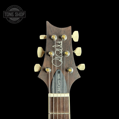 Front of headstock of PRS Wood Library McCarty 594 Black Gold Sunburst 10-top Brazilian FB.