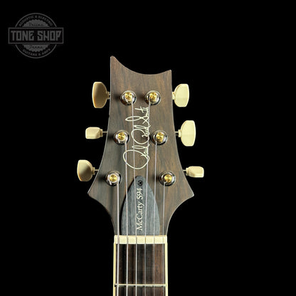 Front of headstock of PRS Wood Library McCarty 594 10-top Quilt Copperhead Burst.