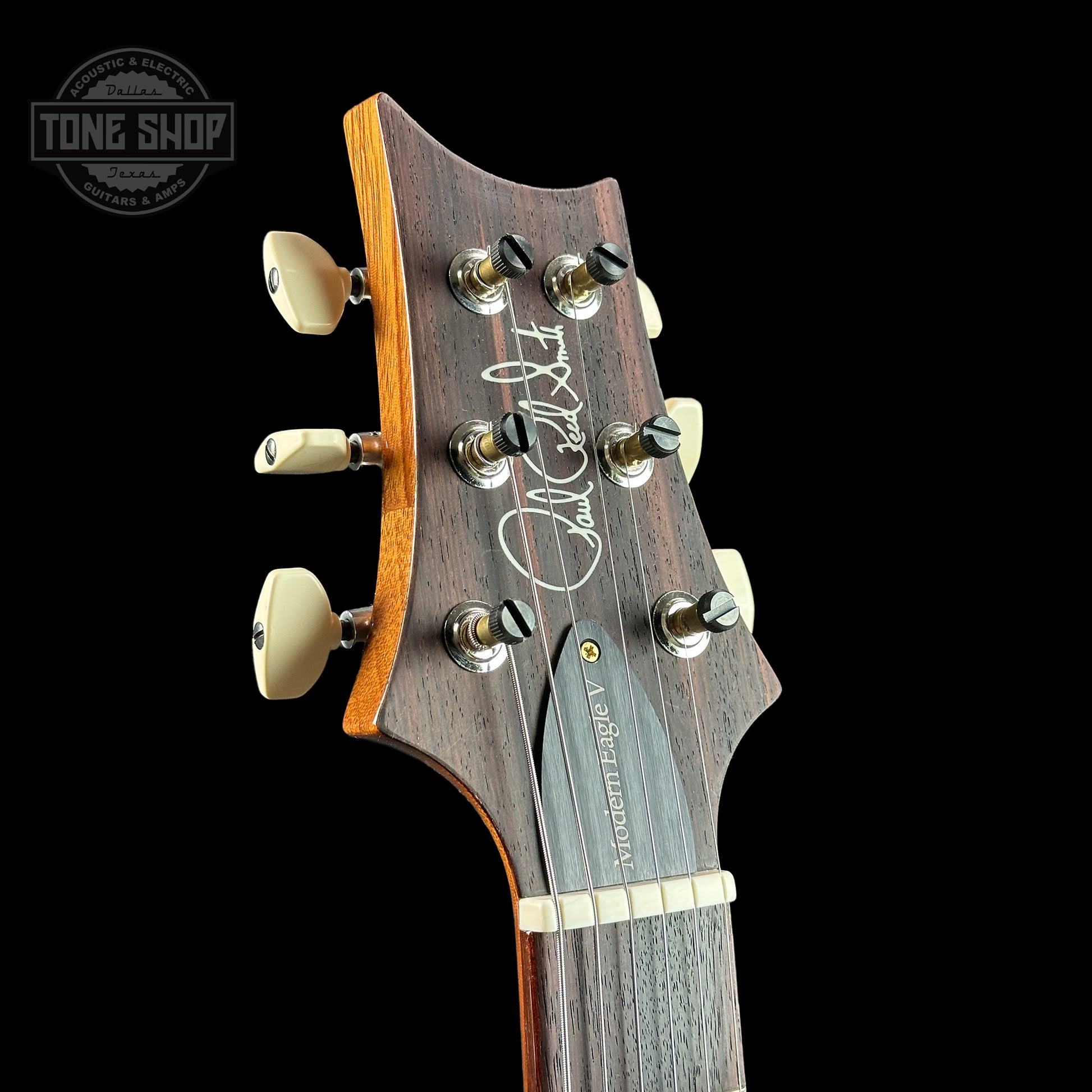 Front of headstock of PRS Modern Eagle V 10 Top Charcoal.