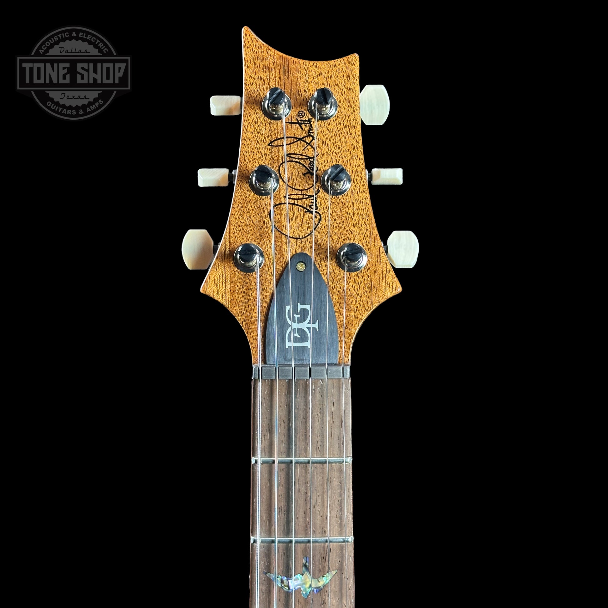 Headstock of PRS TSG Anniversary Wood Library Artist DGT Gold Storm Fade Brazilian Rosewood.