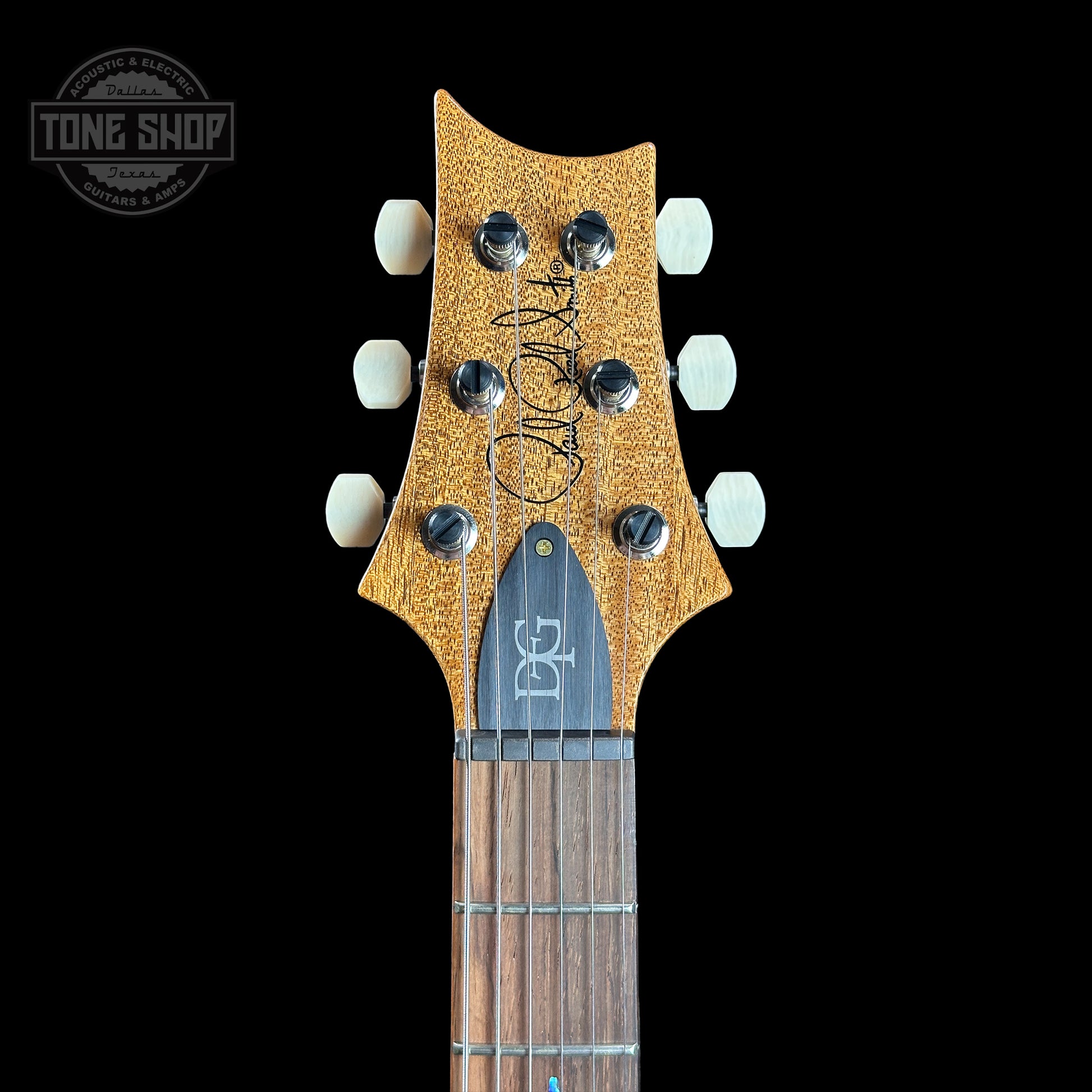 Headstock of PRS TSG Anniversary Wood Library Artist DGT Gold Storm Fade Brazilian Rosewood.