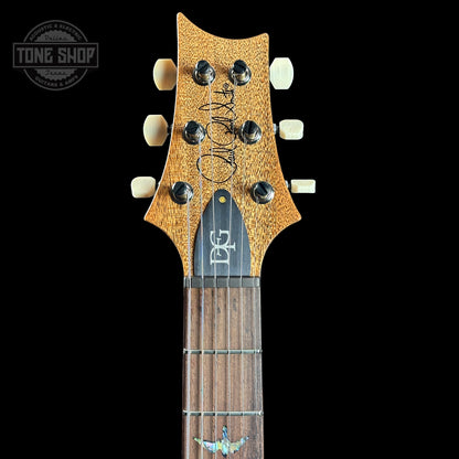 Front of headstock of PRS TSG Anniversary Wood Library Artist DGT Gold Storm Fade Brazilian Rosewood.