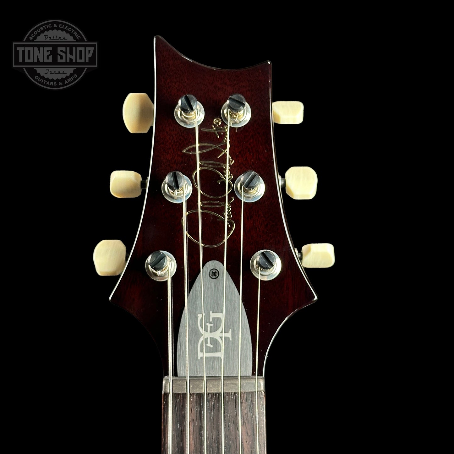 Front of headstock of PRS DGT David Grissom Trem Gold Top w/moons.