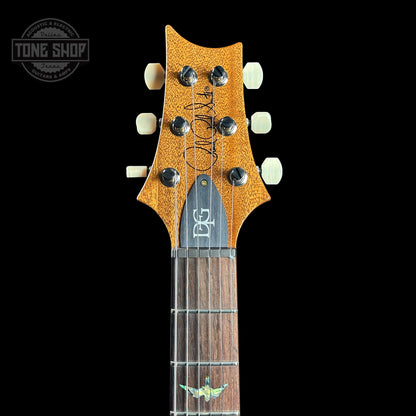 Front of headstock of PRS TSG Anniversary Wood Library Artist DGT Gold Storm Fade Brazilian Rosewood.