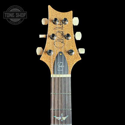 Front of headstock of PRS TSG Anniversary Wood Library Artist DGT Gold Storm Fade Brazilian Rosewood.