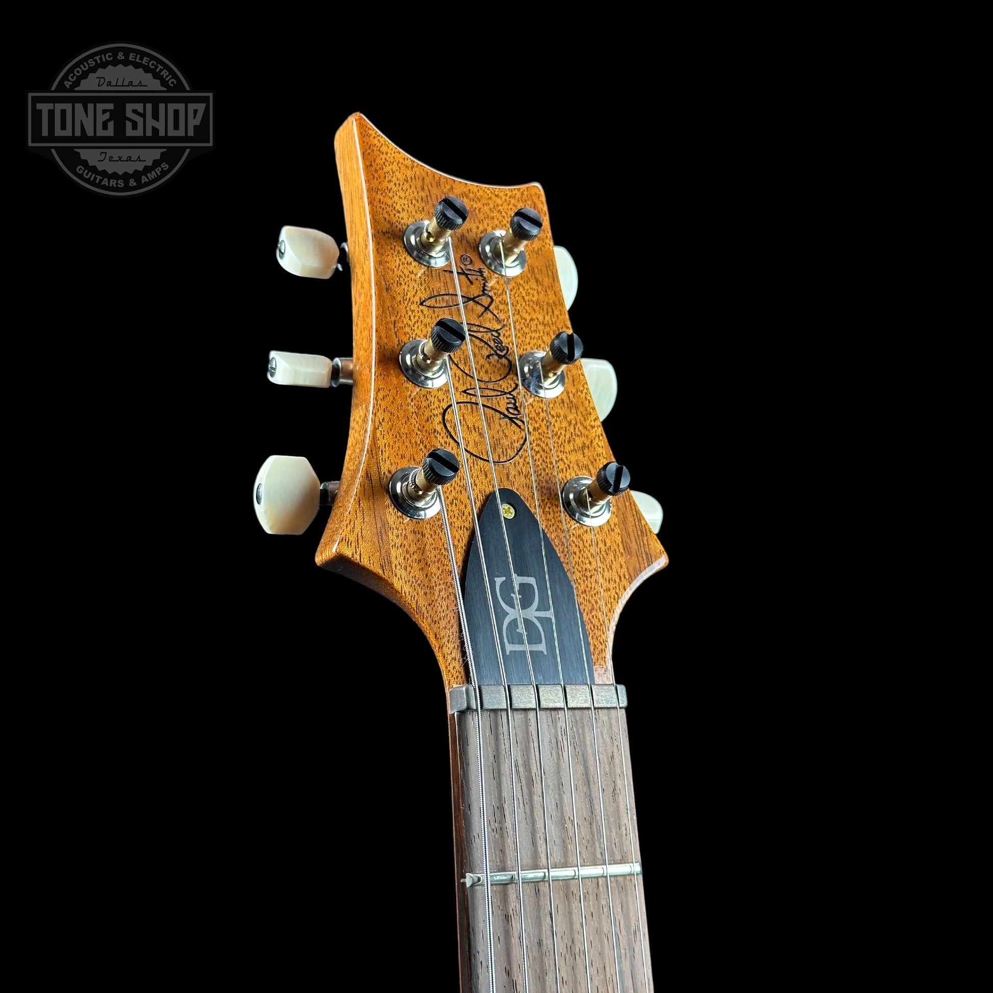 Front of headstock of PRS TSG Anniversary Wood Library Artist DGT Frostbite Smokeburst.