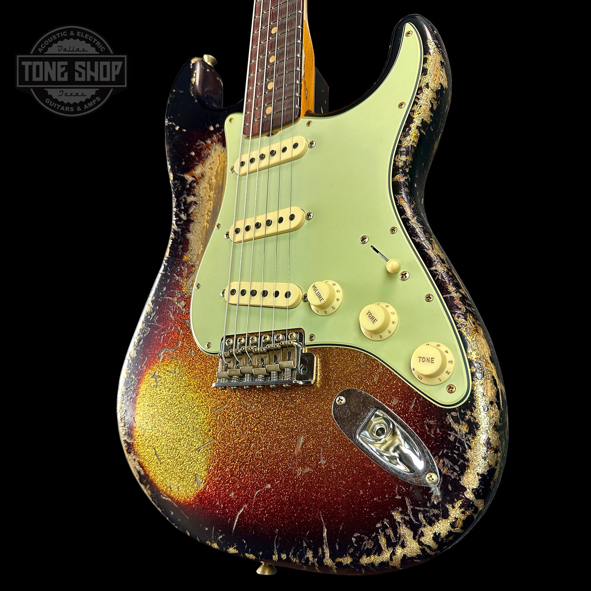 Front angle of Fender Custom Shop Time Machine '63 Strat Super Heavy Relic Super Faded Aged 3 Color Sunburst Sparkle.