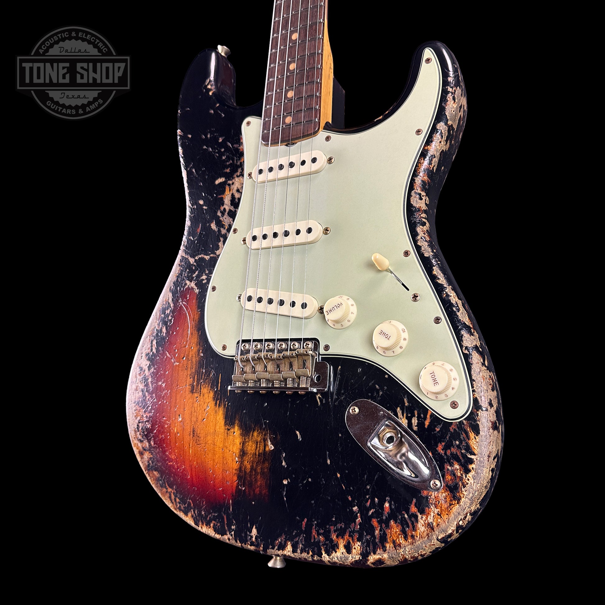 Front angle of Fender Custom Shop Time Machine '63 Strat Super Heavy Relic Super Faded Aged Black Over 3 Color Sunburst.