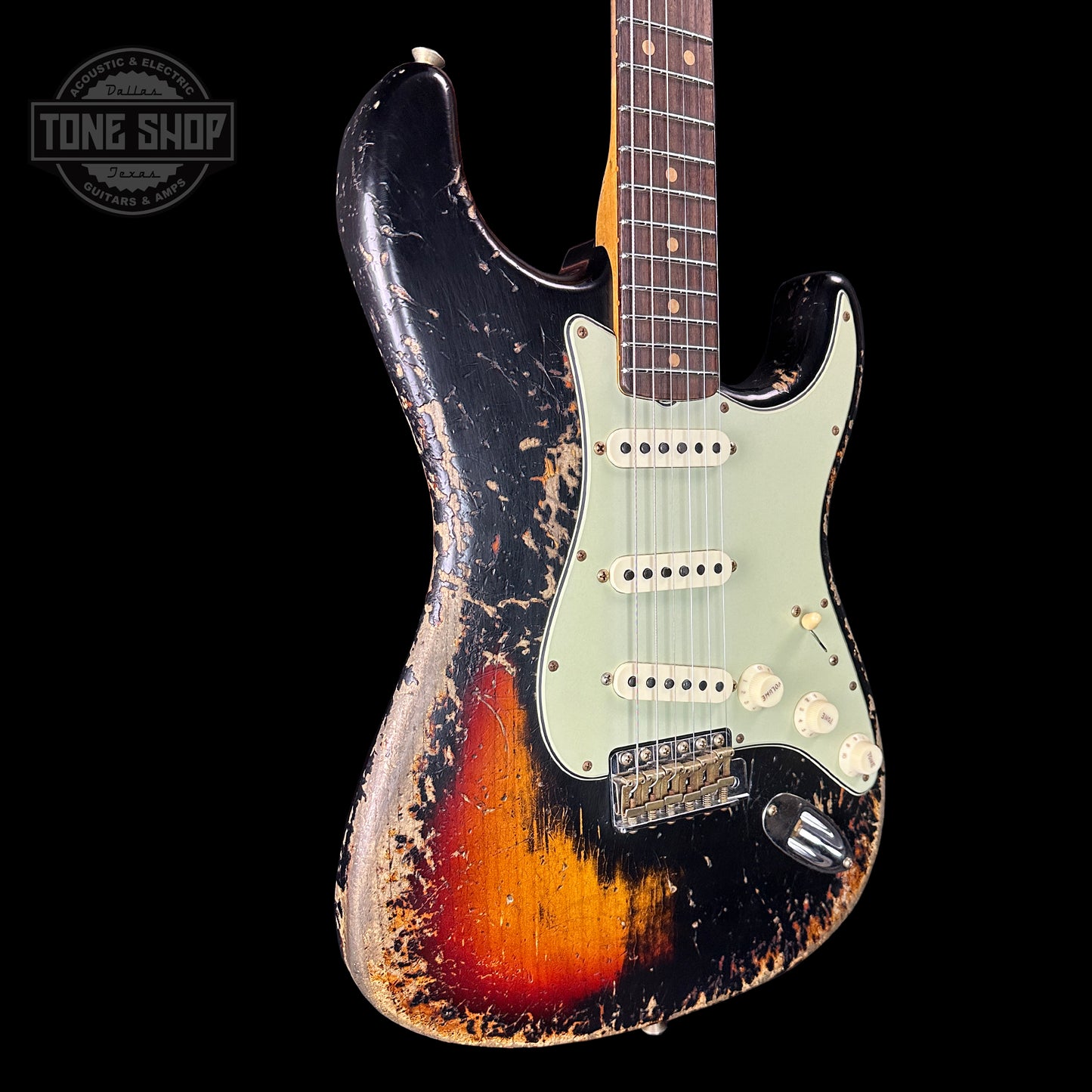 Front angle of Fender Custom Shop Time Machine '63 Strat Super Heavy Relic Super Faded Aged Black Over 3 Color Sunburst.