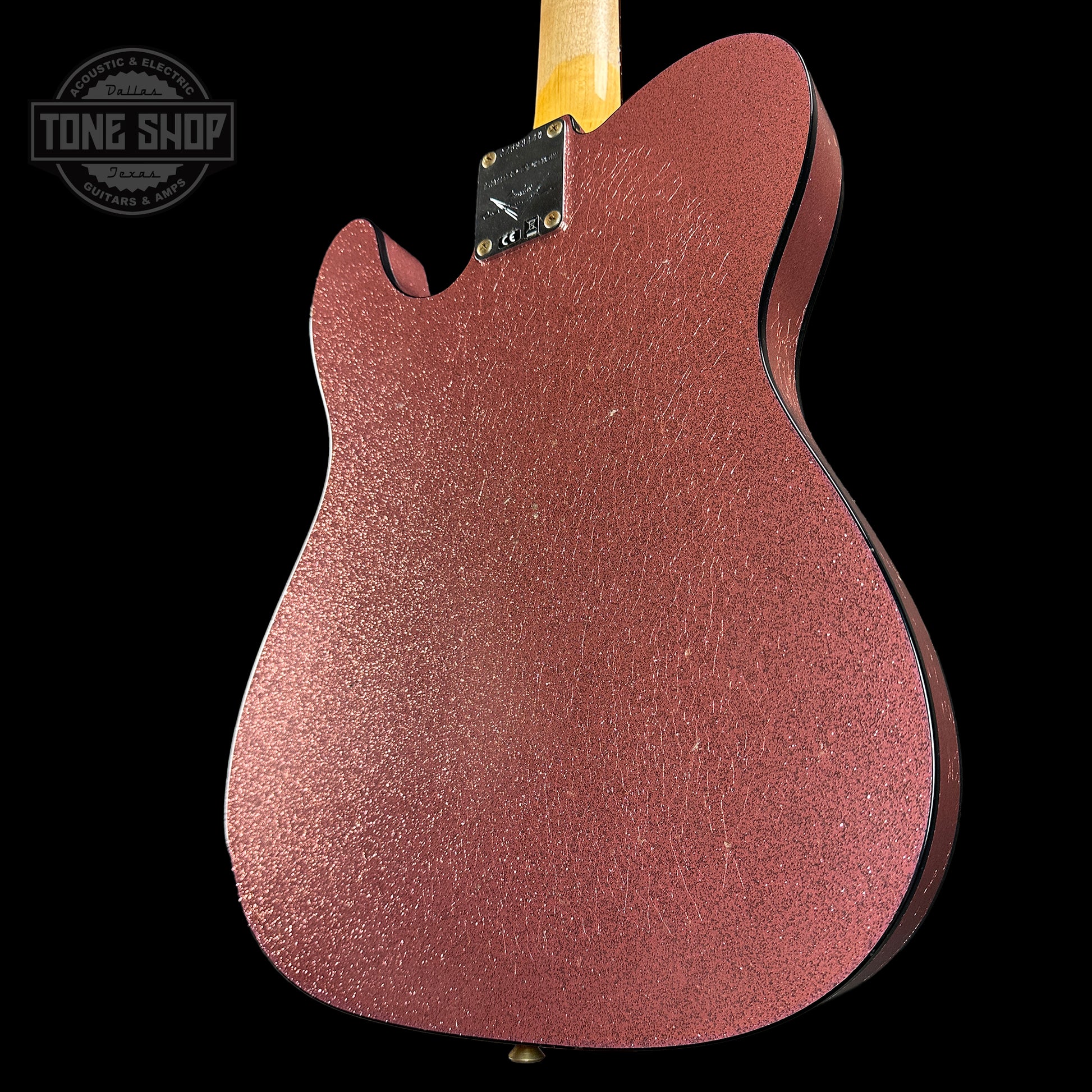 Back angle of Fender Custom Shop Limited Edition Cunife Tele Custom Journeyman Relic Aged Champagne Sparkle.