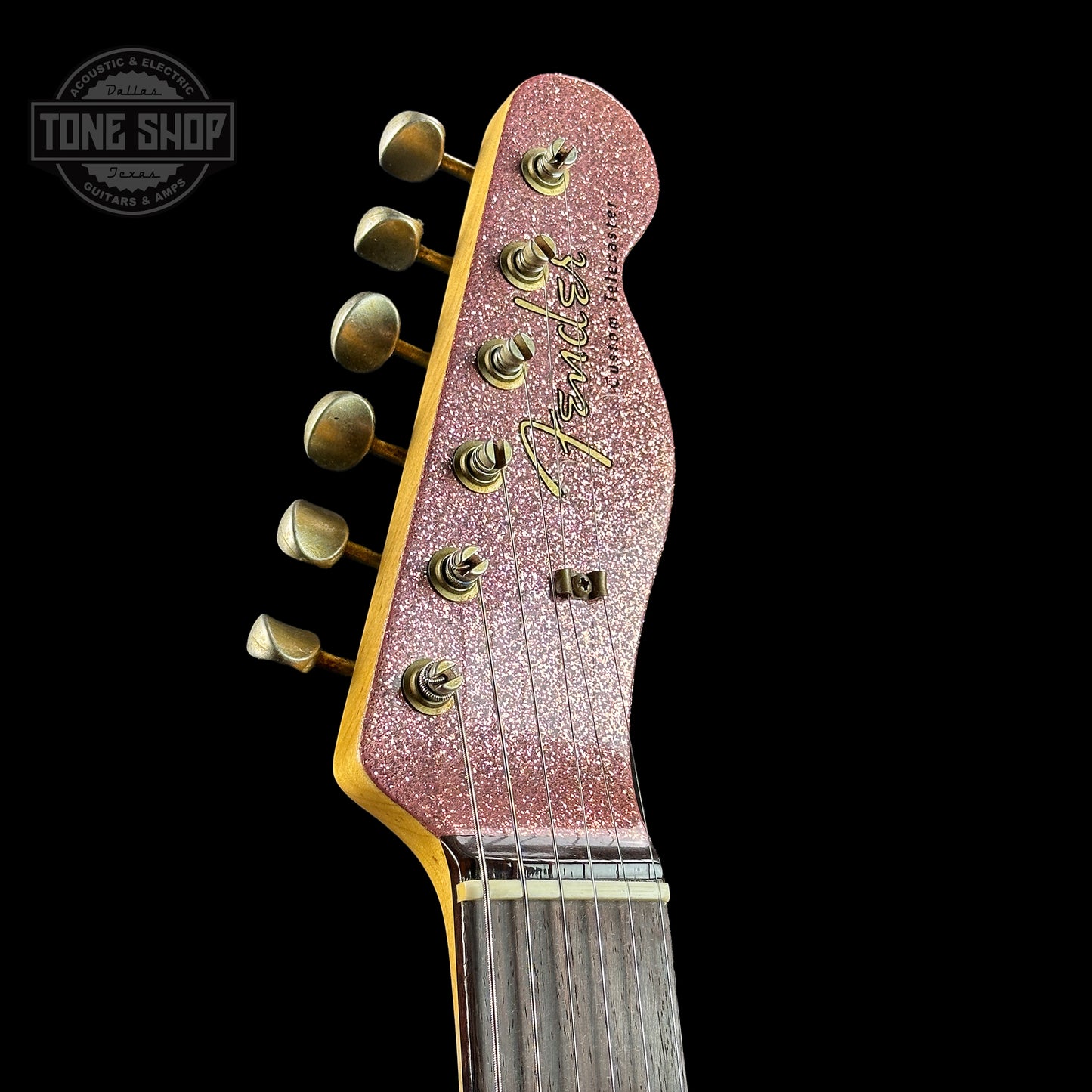 Front of headstock of Fender Custom Shop Limited Edition Cunife Tele Custom Journeyman Relic Aged Champagne Sparkle.